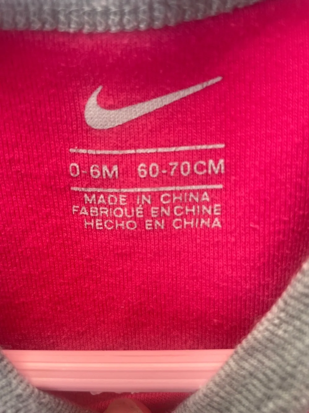 Nike Pink and  White Logo Infant Bodysuit‎ Wall Display